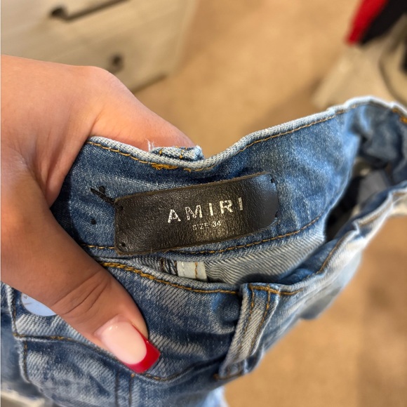 Distressed Blue Jeans with Patterned Rips - Picture 4 of 4